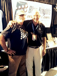 Fred Morrison, Troopers Director with Mark Arnold, Blue Knights Director, at the Blue Knights Marketplace during the 2014 DCI World Championships in Indianapolis, IN.