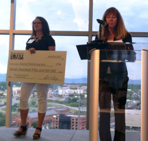 Jordan Jacobsen accepts the third place award while Colfax Marathon CEO Andrea Dowdy comments on Ascend's mission and programs.